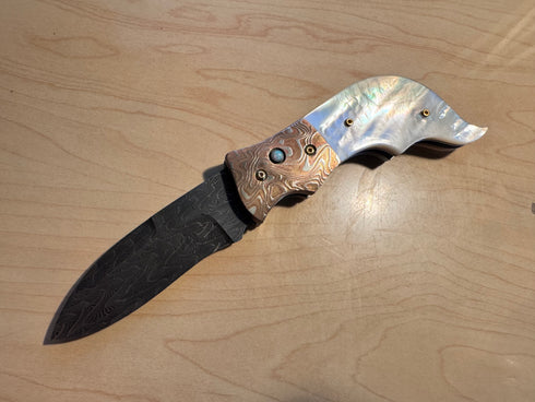 Auto-folding knife