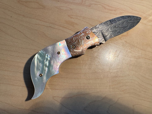 Auto-folding knife