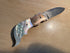 Auto-folding knife