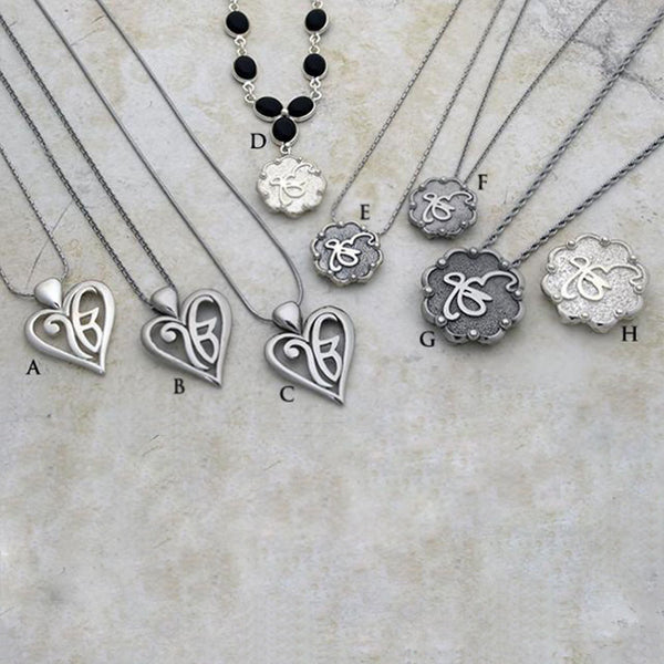 Varied stylized and heart shaped Ekongkar pendants on gemstone necklaces and varied chains