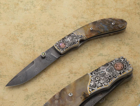 Engraved plume agate folding knife