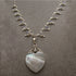 Heart shaped silver mother of pearl pendant on silver rainbow moonstone necklace