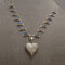 Heart shaped silver mother of pearl pendant on silver labradorite necklace