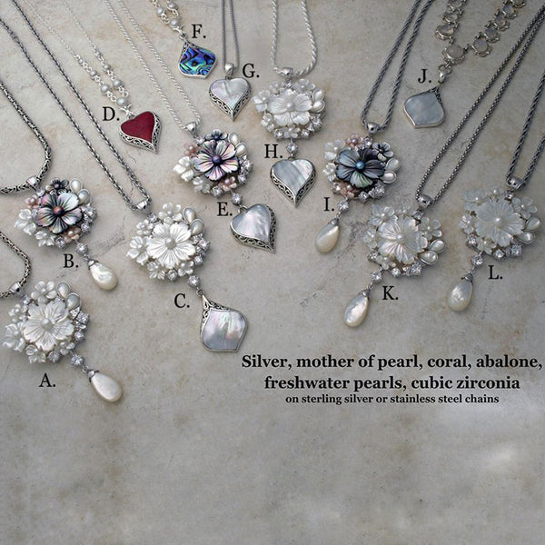 Carved mother of pearl and freshwater pearl necklaces