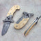 Fossil ivory button lock folding knife