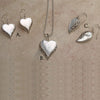 Heart shaped silver mother of pearl pendant on silver labradorite necklace