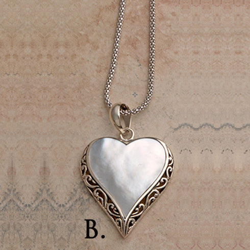 Heart shaped silver mother of pearl pendant on silver labradorite necklace