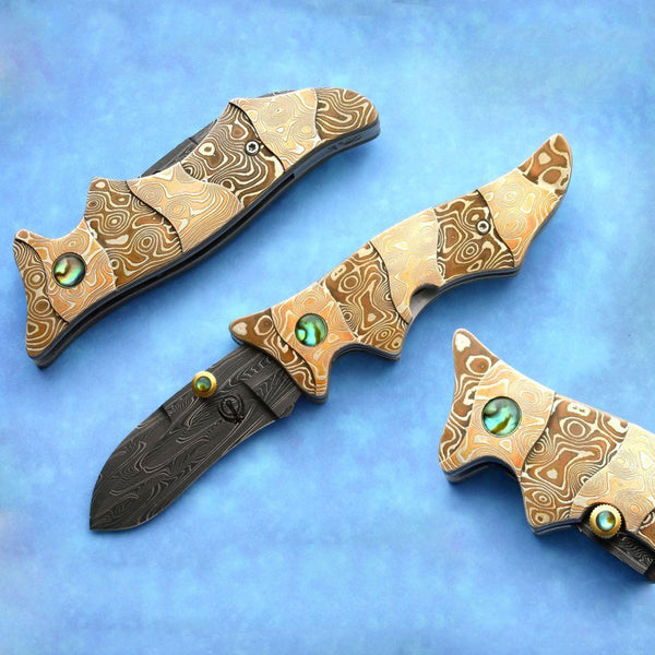 Carved mokume folding knife