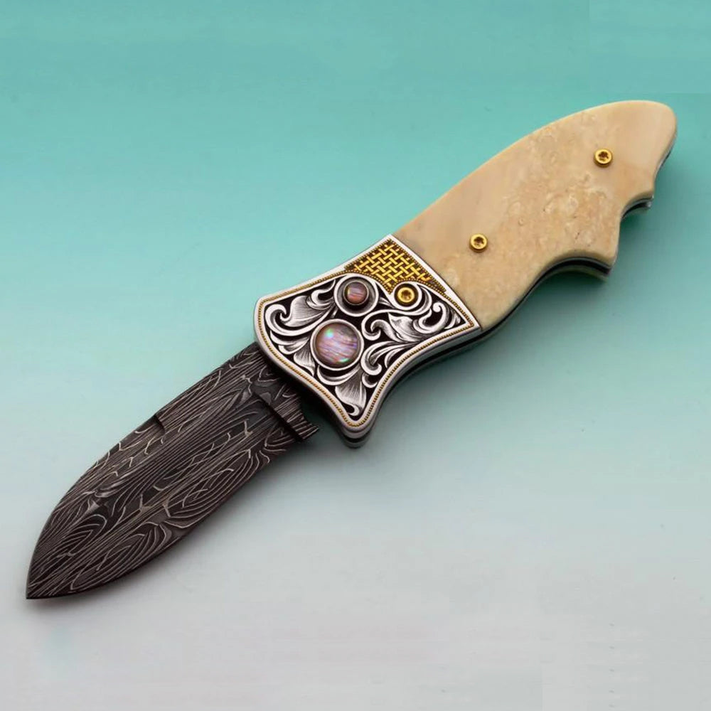 Engraved fossil ivory button lock folding knife