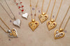 Elegant heart-shaped pendants on chains - some with gemstones, symbols and mother of pearl