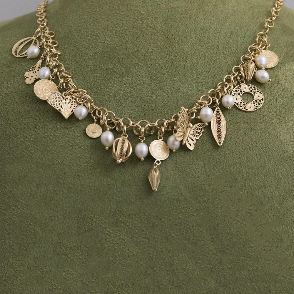 Pearl and charm necklace