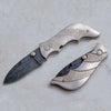 Carved silver folding knife