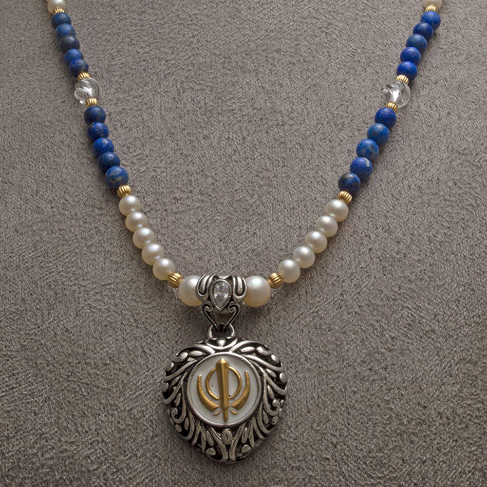 Two-tone steel heart Khanda pendant on freshwater pearl, lapis lazuli and carved clear quartz bead necklace