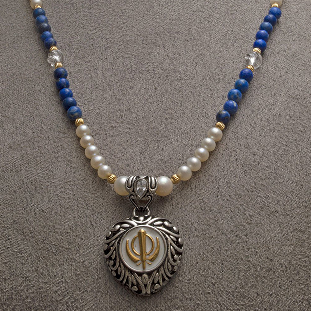 Two-tone steel heart Khanda/Adi Shakti pendant on freshwater pearl, lapis lazuli and carved clear quartz bead necklace
