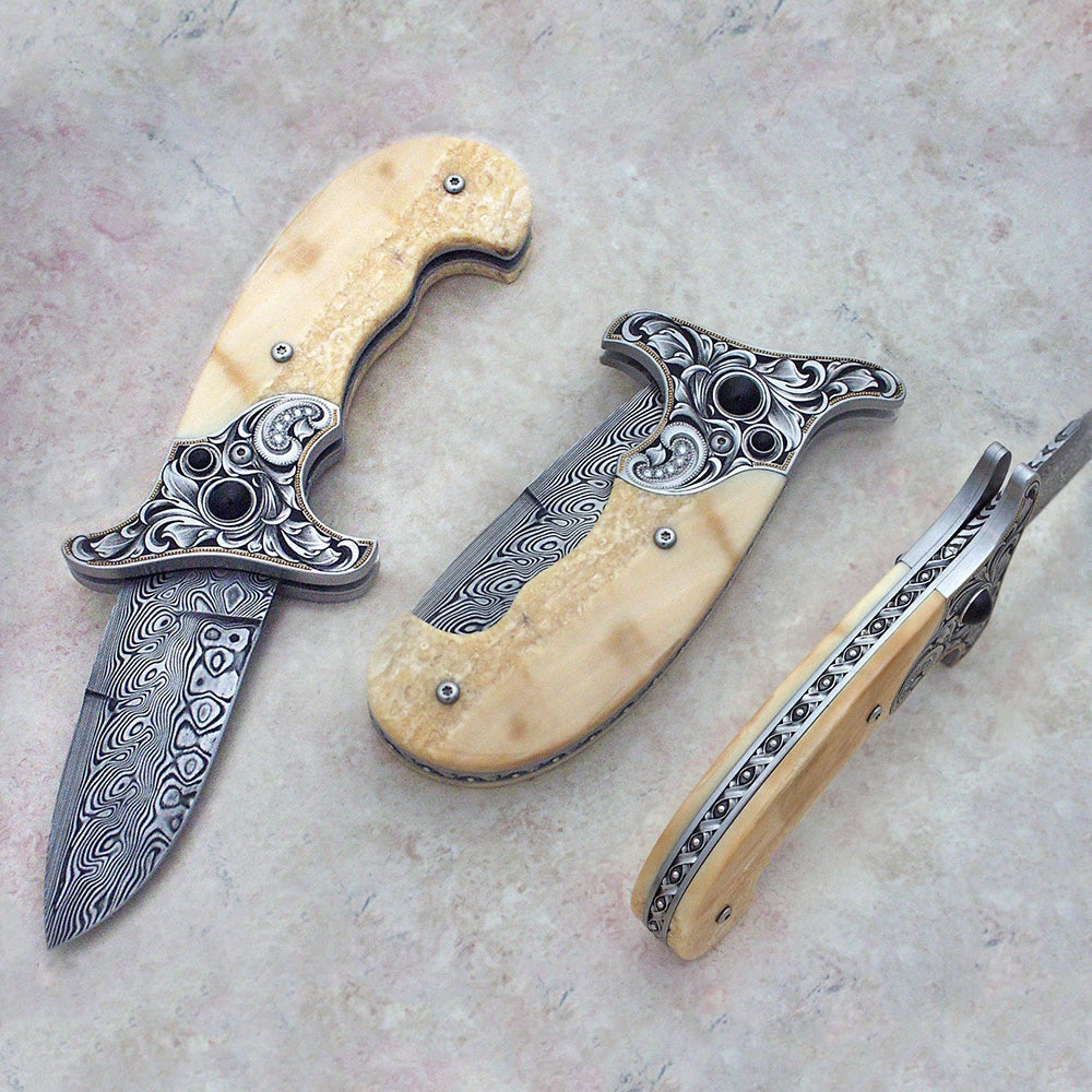 Fossil ivory button lock folding knife