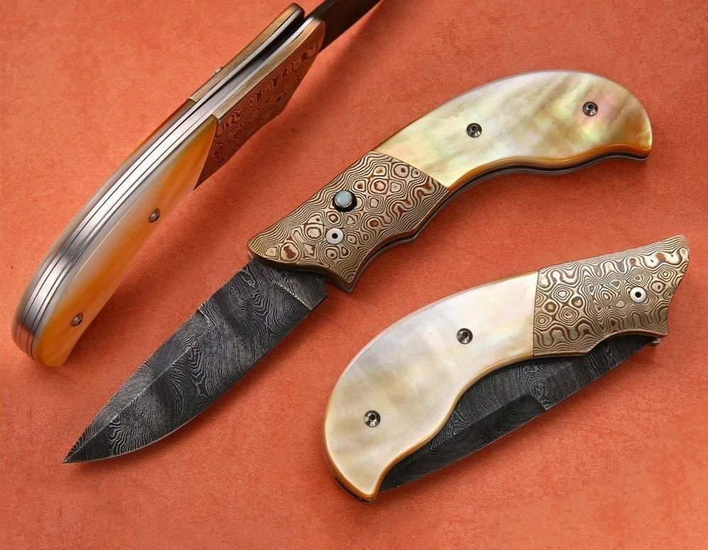 Gold mother of pearl folding knife