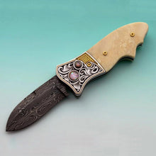 Load image into Gallery viewer, Engraved fossil ivory button lock folding knife
